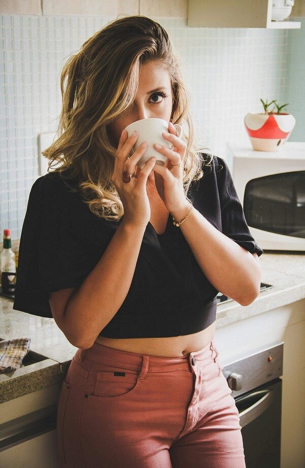 Woman Wearing Red Jeans and Black top for there date 