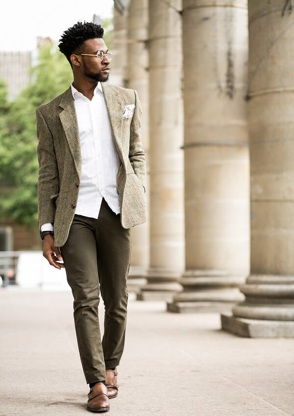 Businessman wearing a green blazer paired with monk-strap shoes.